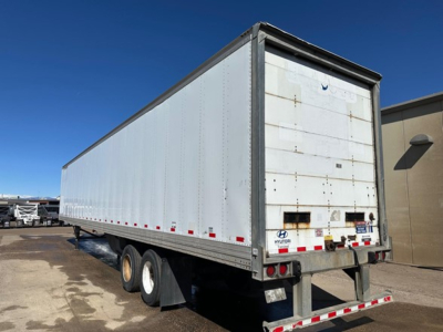 Trailer rear and side view of a 2015 Hyundai air ride dry van with white box, dual rear axles, and rear underrun bar.