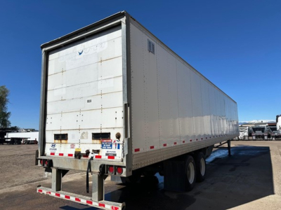 Trailer rear and side view of a white Hyundai air ride dry van trailer with dual axles and rear doors.