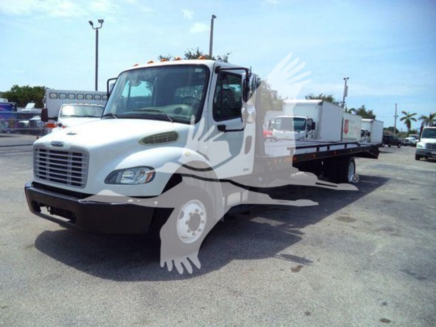 2012 Freightliner Business Class M2 106 flatbed truck in a used lot, VIN 1FVACWDT1CHBP9505, stock TBP9505
