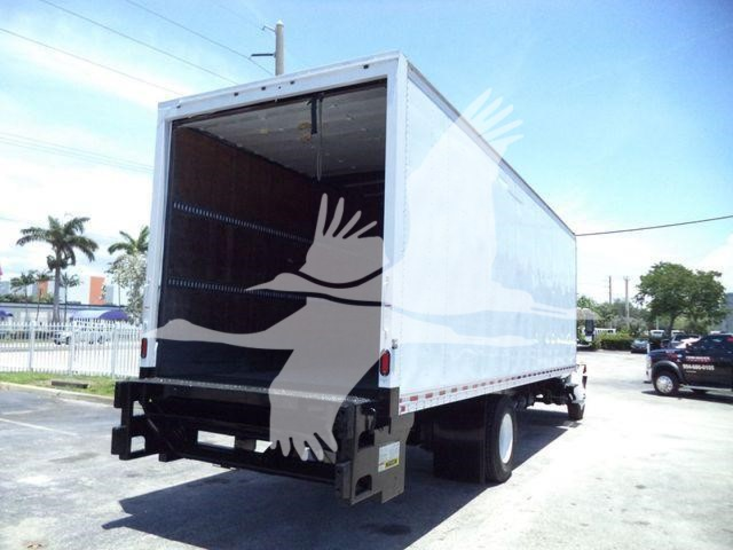 Box truck back and side view showing cargo area of a 2019 International Durastar 4300 with open rear doors.