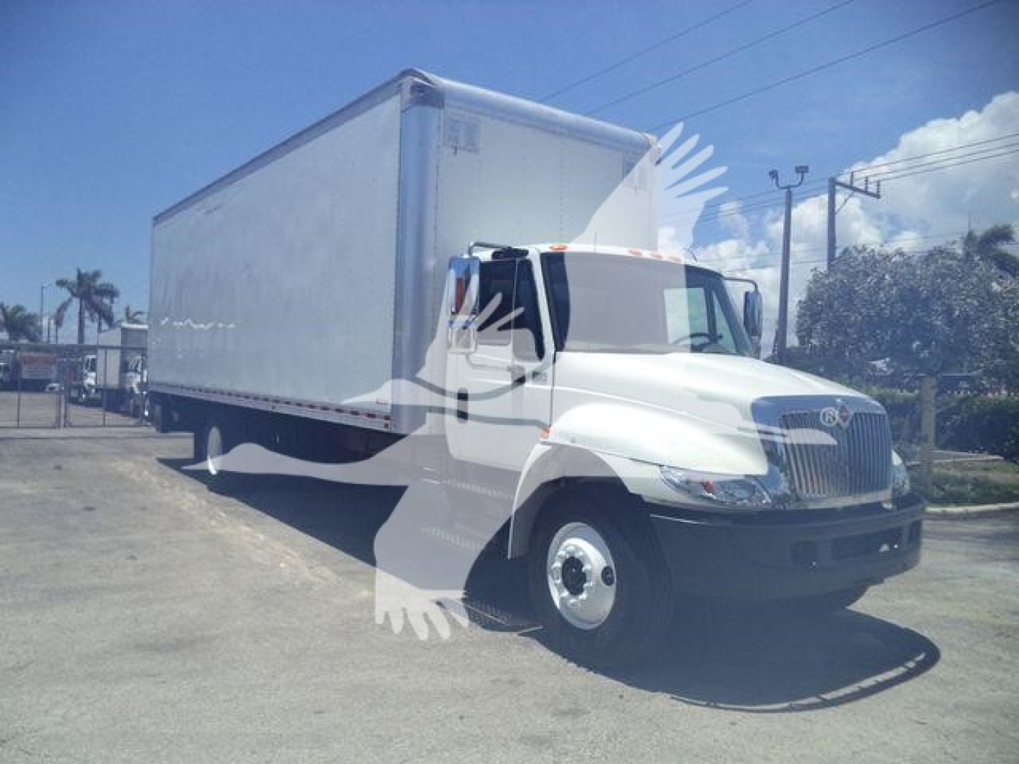 International Durastar 4300 box truck in service showing front cab and large box cargo area