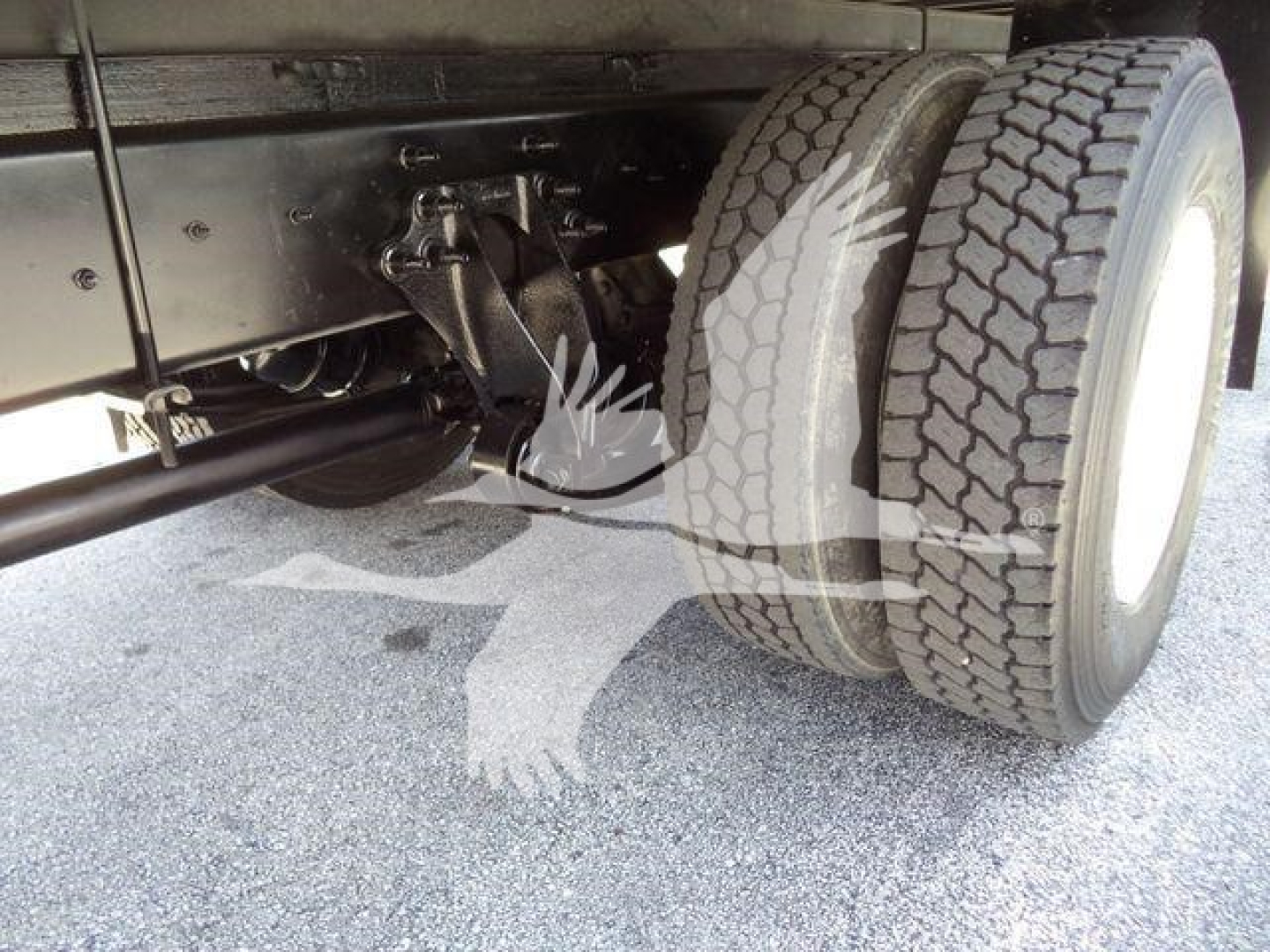 International Durastar 4300 truck chassis showing dual rear wheels and suspension components.
