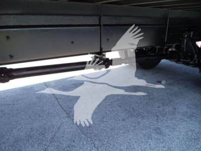 Truck undercarriage showing hydraulic lines and underbody drivetrain in the International Durastar 4300.