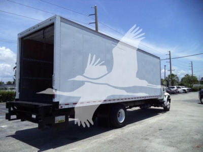 Box truck in service showing cargo box with open rear and International brand cab, 2019 Durastar 4300 stubbed by storage site watermark.