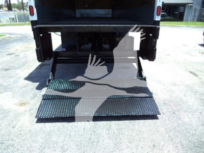 Truck bed with lowered ramp of a 2019 International Durastar 4300 in-service used truck showing the loading ramp.