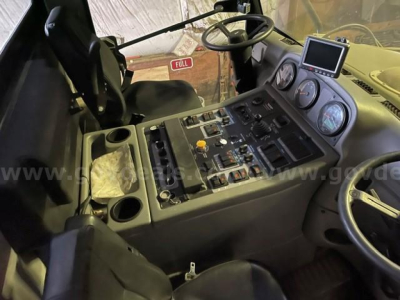 Elgin Pelican sweeper cab interior showing control panel with gauges and steering wheel.
