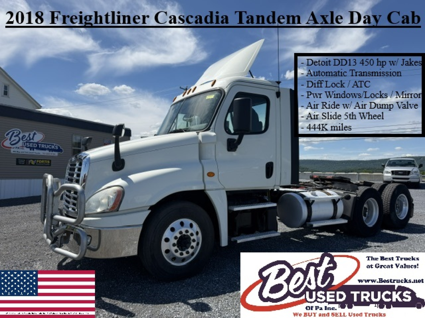 Truck cab in view showing 2018 Freightliner Cascadia Tandem Axle Day Cab with chrome bumper guard and side text panel listing features.