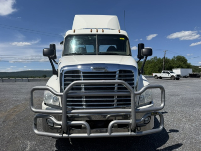 Freightliner Cascadia CA125DC truck front view with a protective grille guard and chrome grille.