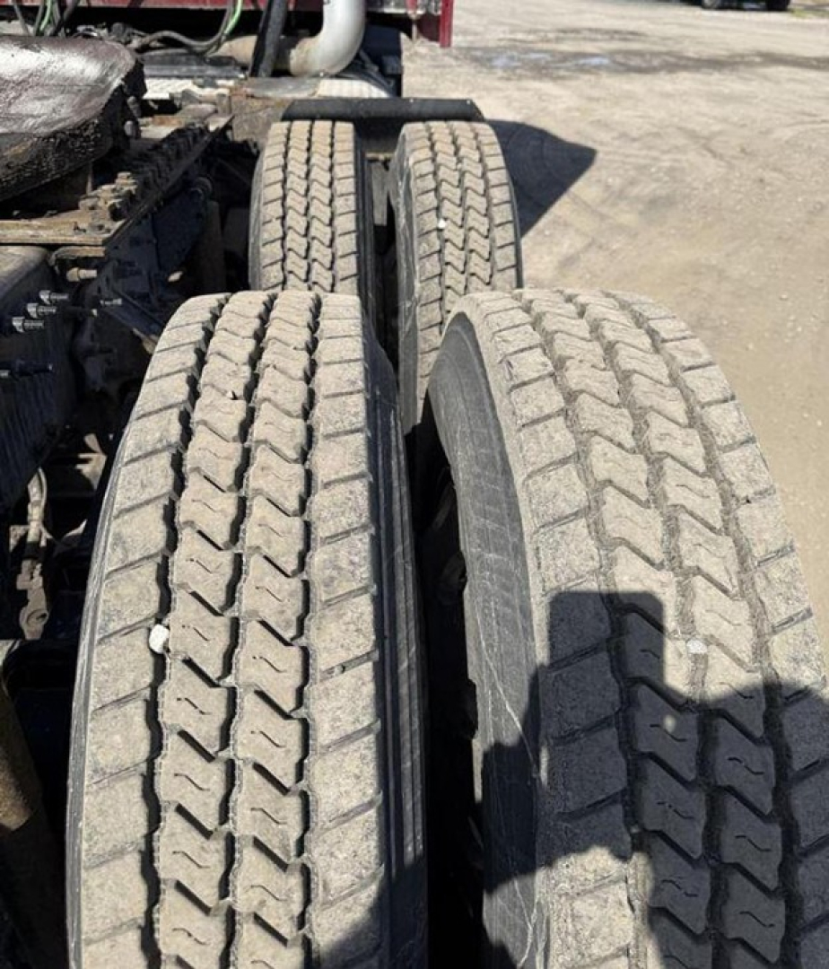 Truck dual rear tires on a Mack Anthem truck showing tread focused on the left and right tires.