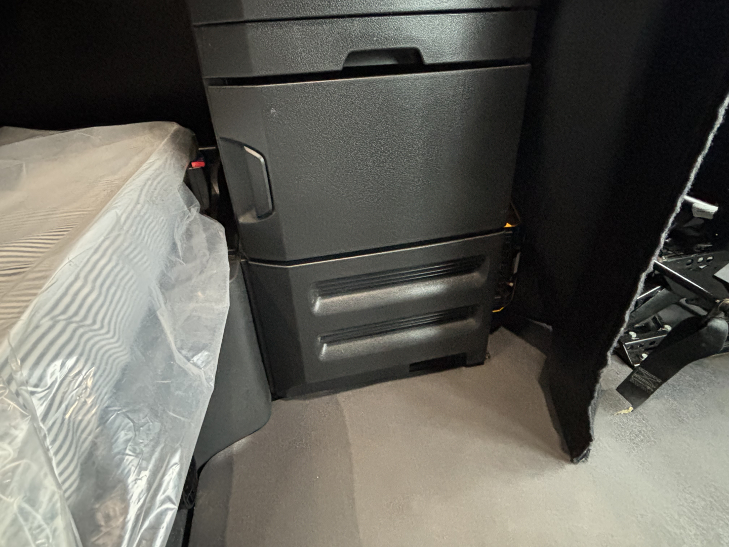 Freightliner Cascadia 126 cab interior showing center console and storage drawers.