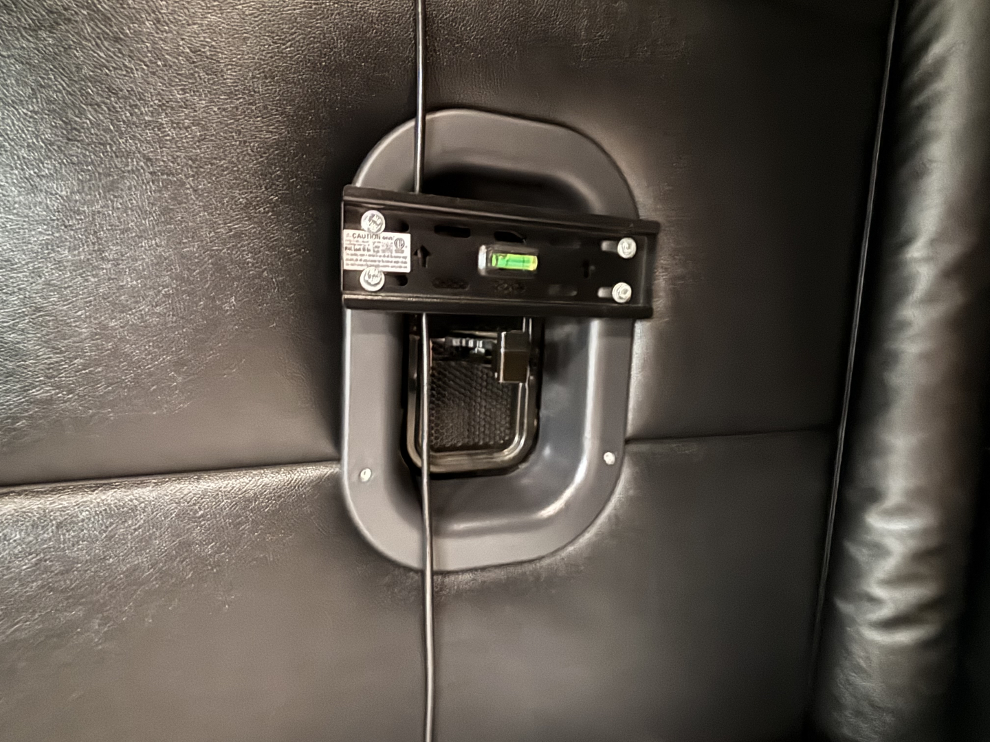Freightliner Cascadia 126 cab interior with a recessed fuel/def gauge area and level indicator mounted on the wall.