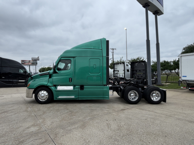 Green Freightliner Cascadia 126 tractor facing left, side view with sleeper cab, chrome steps, dual rear axles, no trailer attached.