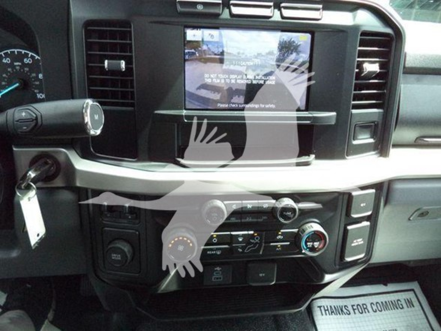 Dashboard of a 2024 Ford F-550 with center touchscreen display and climate controls visible.
