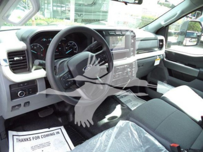 Ford F-550 rollback truck interior showing steering wheel dashboard center console and driver seat