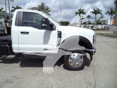 Ford F-550 rollback truck shown in side profile with white cab and dual rear wheels.