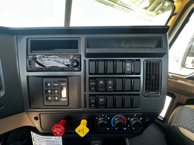 Dashboard panel of a 2027 Mack GR64F cab and chassis showing radio, control switches, and climate controls.