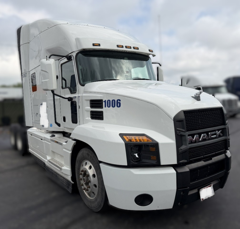 White 2020 Mack Anthem sleeper tractor shown from front-left, with number 1006 on door and bold black grille.
