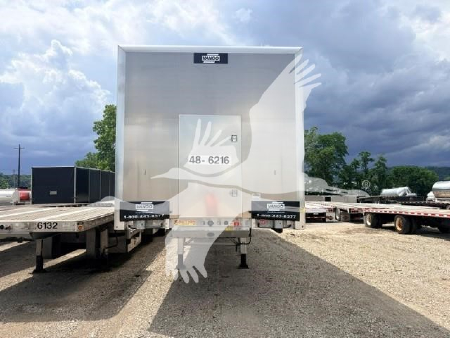 Trailer rear view showing a galvanized steel flat air slider with stock number 48-6216 on back door and VIN 7KYFB4822SED43539 visible.