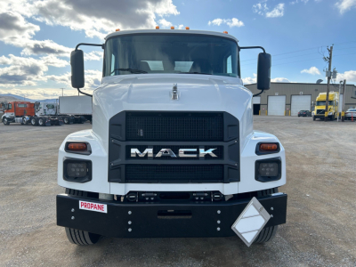 Front view of a white 2026 Mack MD7 truck showing large black front grille with MACK badge, rectangular headlights, and bumper with a Propane placard; VIN and stock not visible in text.