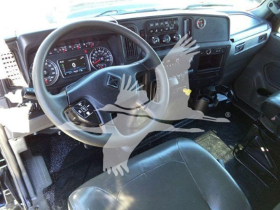 Dashboard and steering wheel of a 2022 International MV cab showing steering wheel controls and instrument cluster.