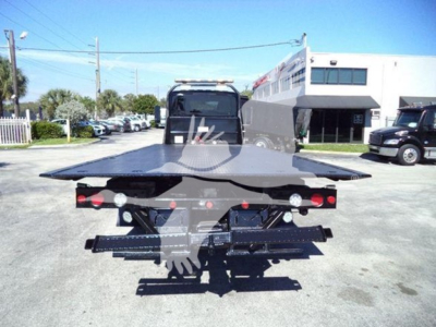 Tow truck flatbed with rear view showing hydraulic system and platform; no legible labels visible on the image.
