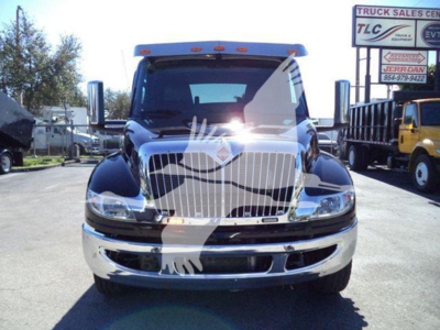 Truck front view showing chrome grille and bumper on 2022 International MV rollback truck.