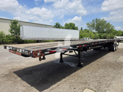 Flatbed trailer in service position showing steel deck, dual rear axles, and rear lights. VIN 1V9FC4823FN062065, stock 7843, Viking trailer