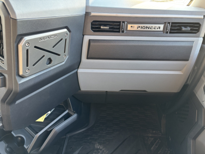 Mack PR64T76H truck interior dashboard view showing Pioneer badge on center console and a side panel with truck branding.