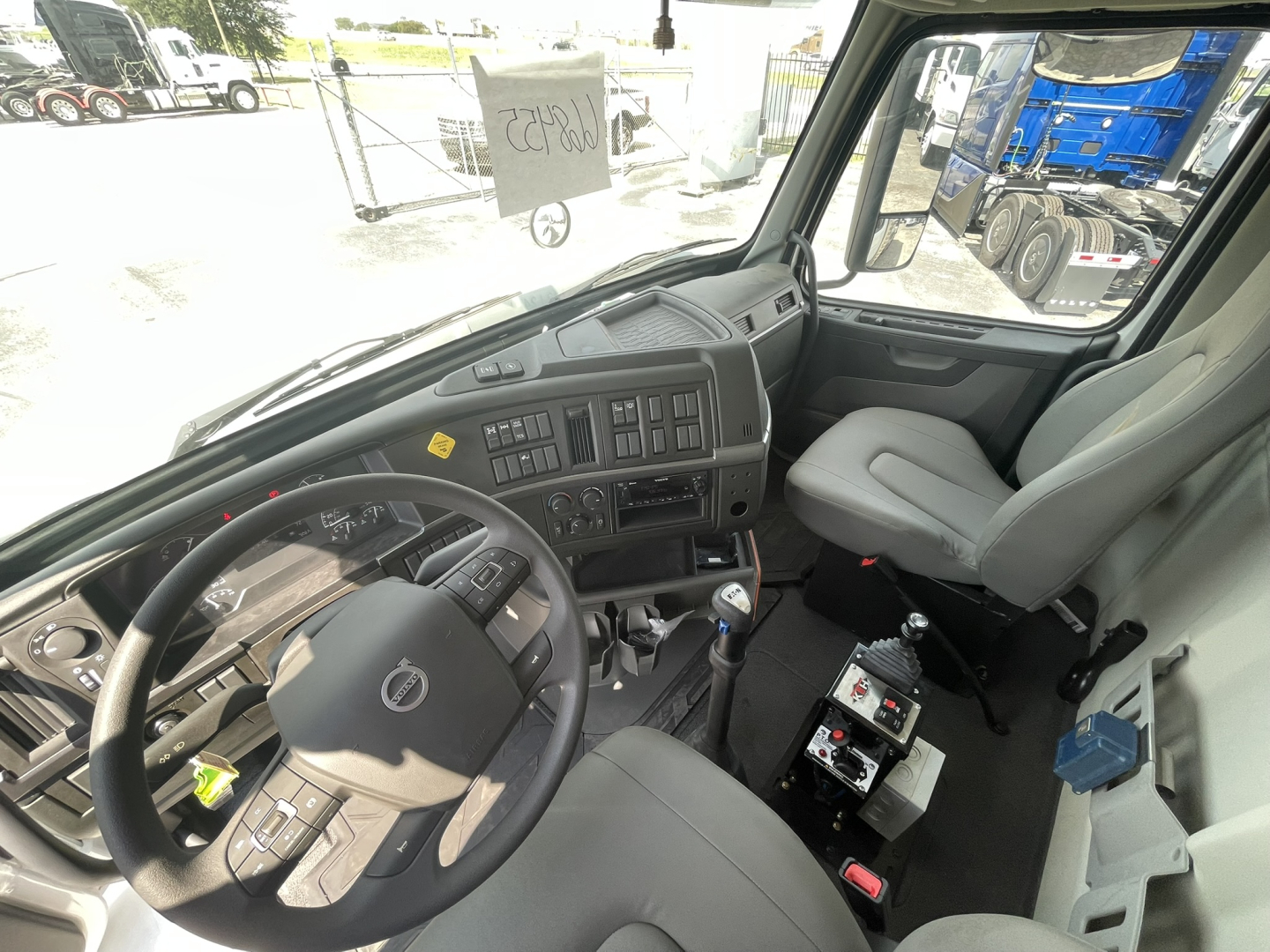 Volvo VHD86B300 cab interior showing dashboard steering wheel and instrument panel.