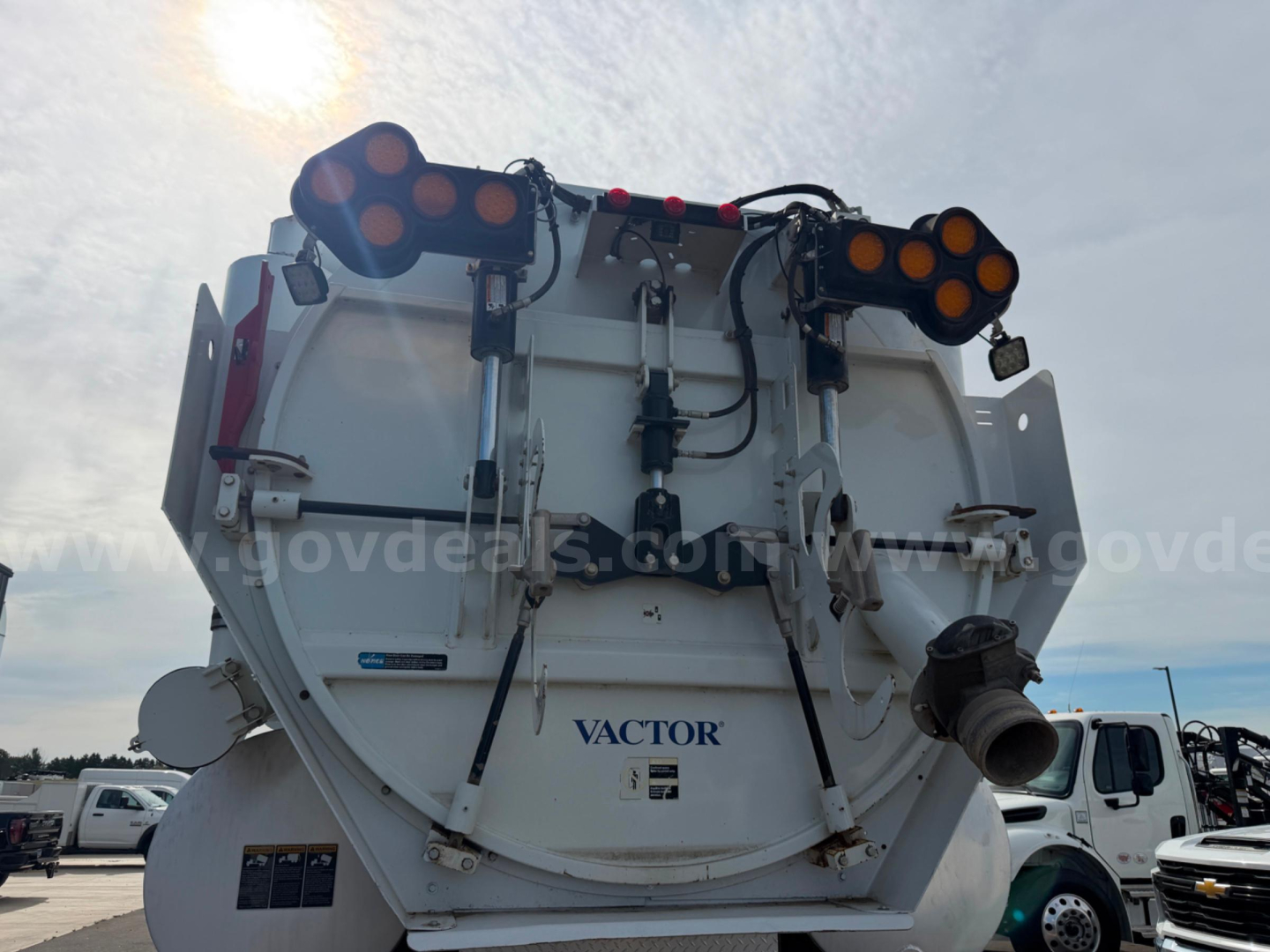 Kenworth T470 Vactor vacuum truck rear view showing Vactor branding and equipment mounts.