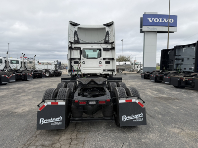 AN64T tractor with fifth wheel and rear view, no cab. View of back of truck chassis and mud flaps.