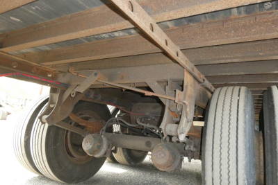 Great Dane 7411T-SSL trailer undercarriage showing dual rear axles, leaf spring suspension, and wheels with tires.