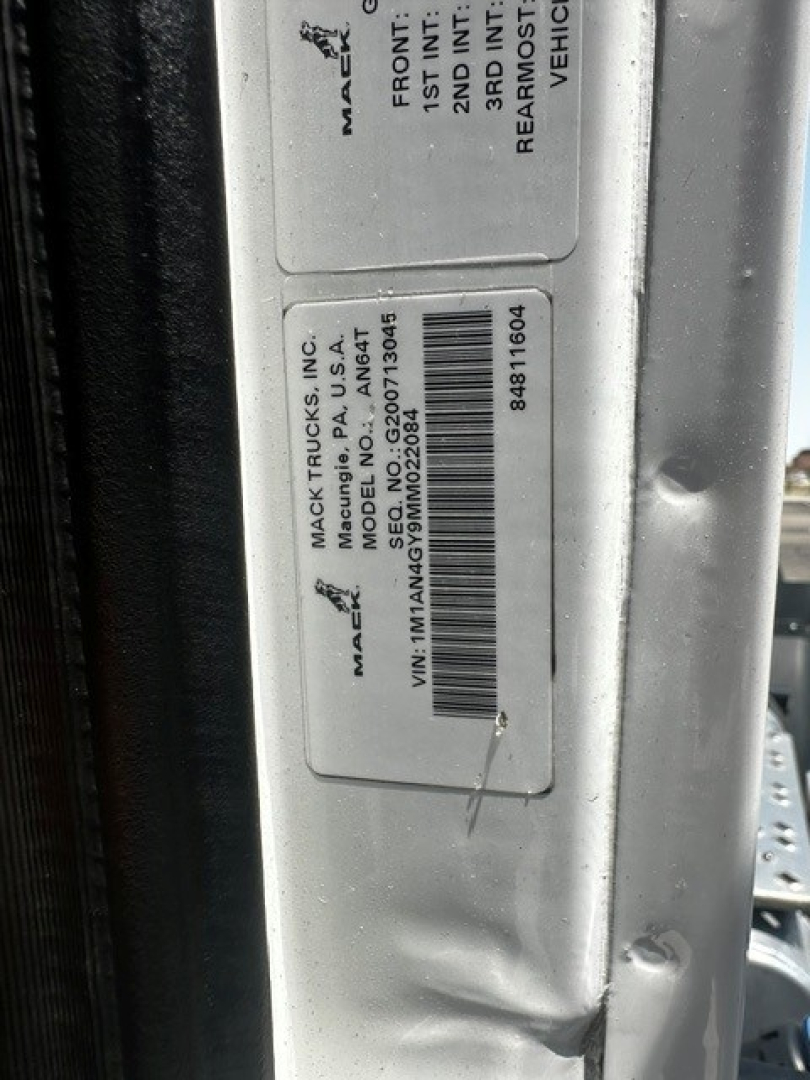 Label on Mack truck door showing VIN bar code and description plates with model ANTHEM. Text includes MACTrucks INC., MADE IN USA, VIN 1M1AN4GY9MM022084, and stock/vehicle details.