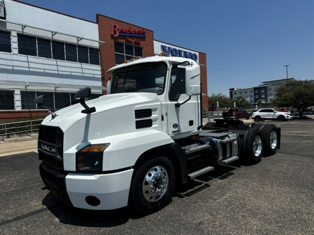 Truck: 2021 Mack Anthem conventional daycab with white exterior, cab mirrors, dual rear axles, and fuel/tank area visible.