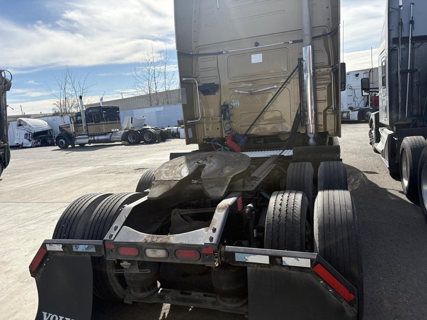 Rear view of a Volvo 770 truck tractor showing fifth wheel, rear tires, and bumper with reflective markers.