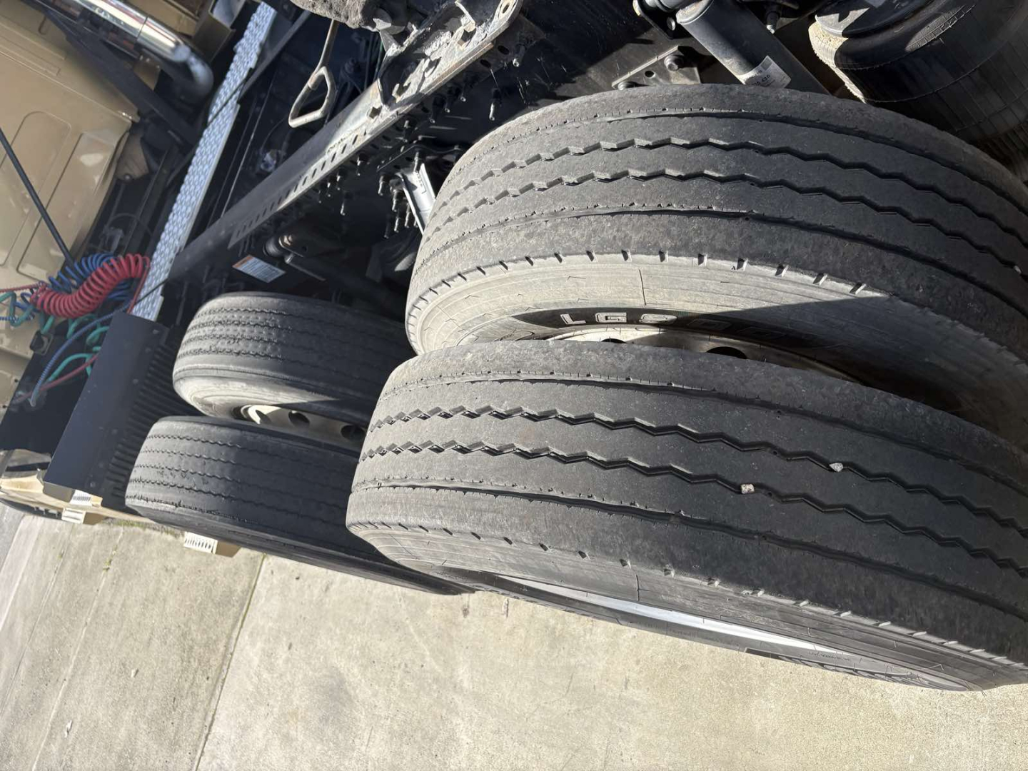 Dual rear tires and undercarriage of a Volvo 770 truck with visible tires and chassis components.