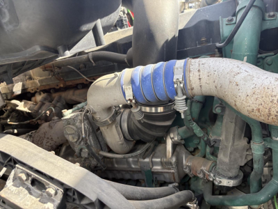 View of a Volvo 770 engine bay with visible intake hose, turbo, and piping; no legible brand labels or model numbers readable in the image.