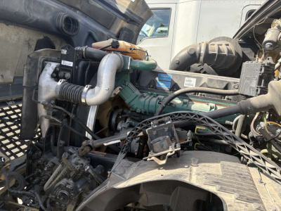 Volvo 770 engine bay with turbo, hoses and belts visible.