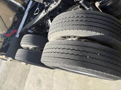Dual rear tires and undercarriage of a Volvo 770 truck with visible tires and chassis components.