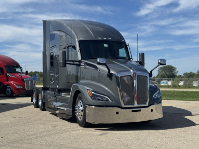 Kenworth T680 truck in-service showing aerodynamic sleeper cab and front grille with Kenworth emblem.