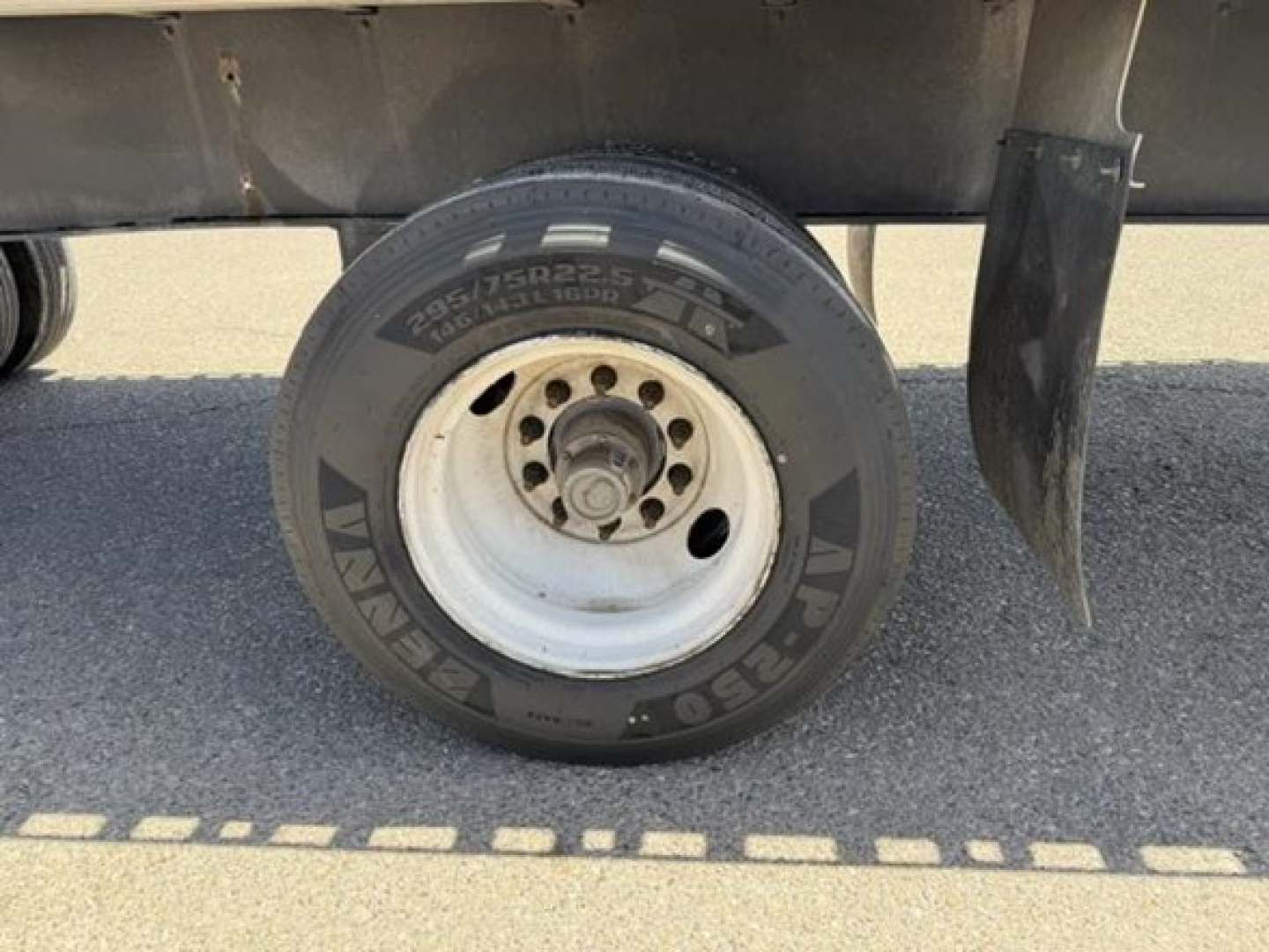 Trailer wheel with Yokohama tire showing embossed text Versa tab? It reads 'VP75...' and tire brand 'Yokohama' on sidewall.