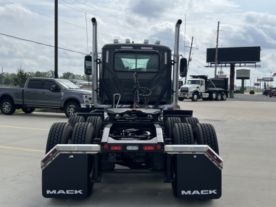Front view of a 2027 Mack PI64T truck cab chassis showing dual rear axles and rear lights.