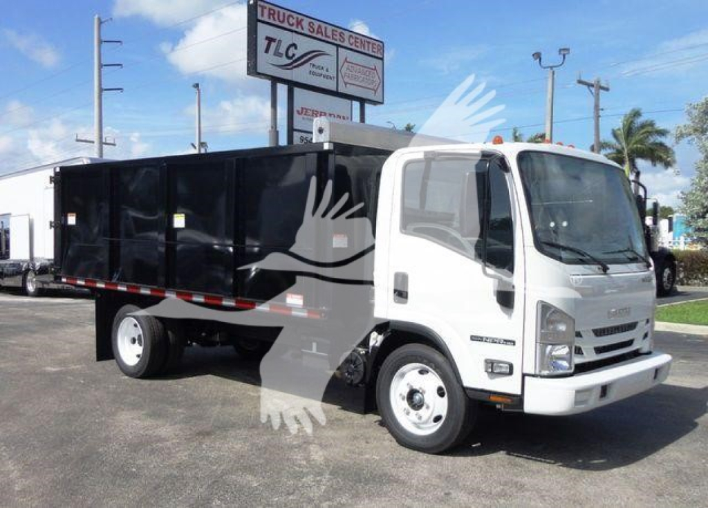 Isuzu NPR HD dump truck side view showing white cab and black dump body with TLC Truck Sales Center sign in background.