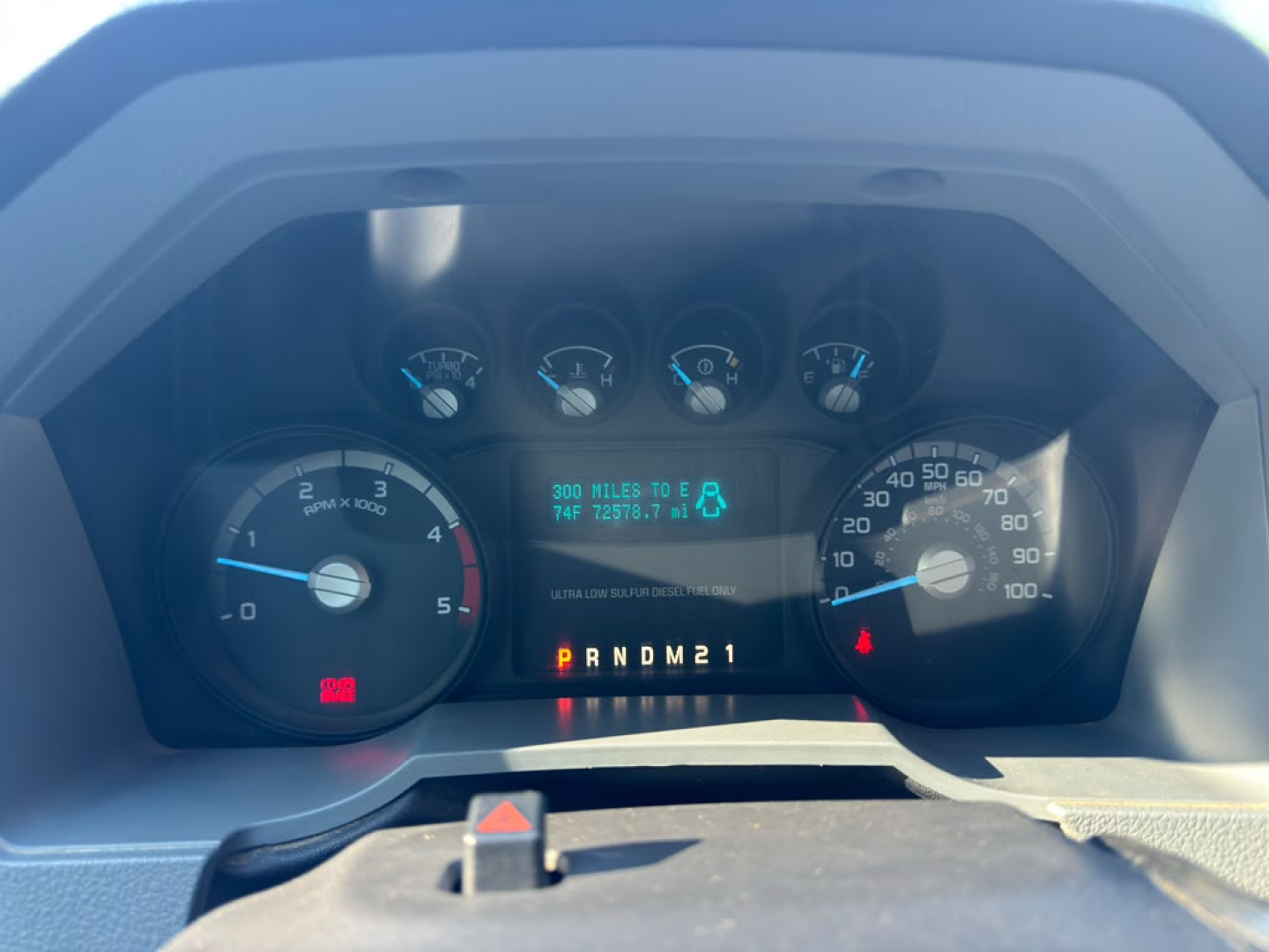 Dashboard of a 2016 Ford F550 showing instrument cluster with tachometer, speedometer, and digital display indicating miles and gear selection.