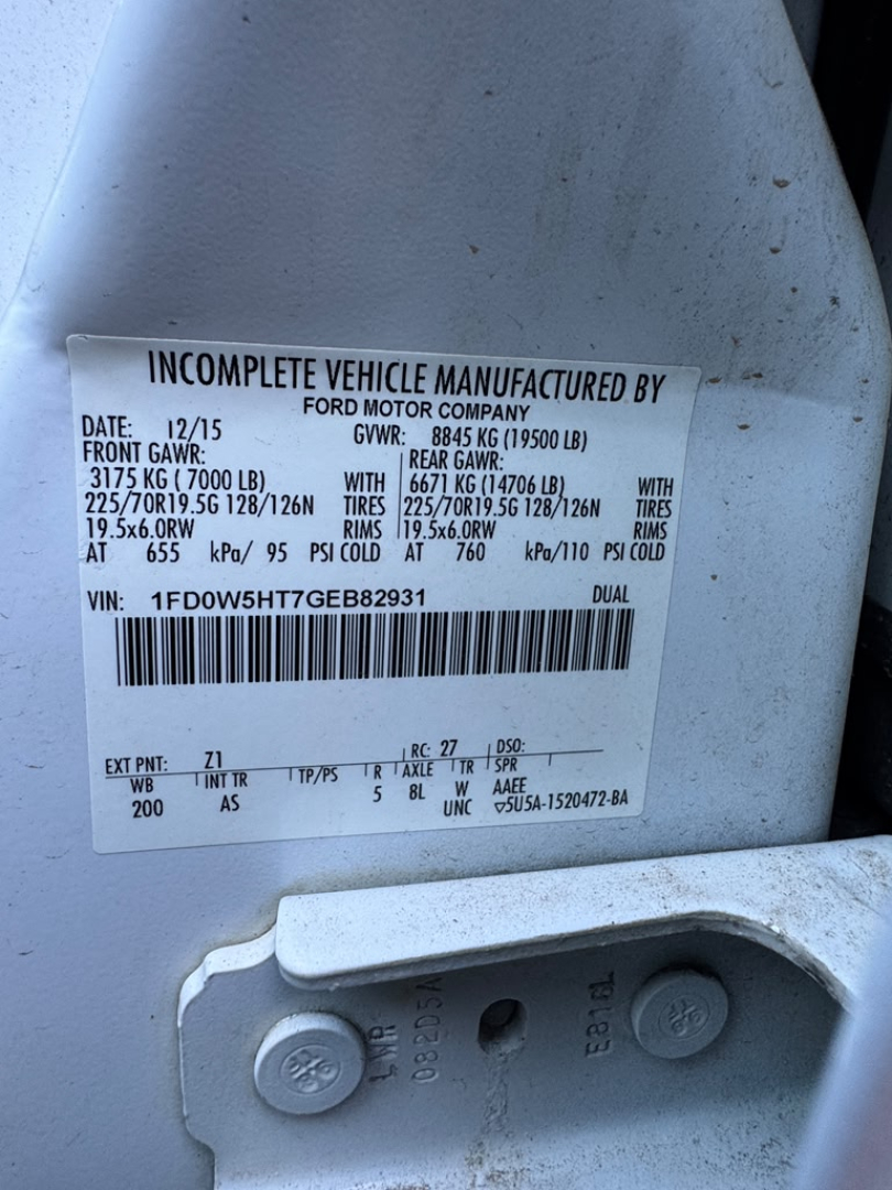 Label on a Ford F-550 showing vehicle data: INCOMPLETE VEHICLE MANUFACTURED BY FORD MOTOR COMPANY, VIN: 1FD0W5HT7GEB82931, FRONT GAW? 3175 KG (7000 LB) with? 225/70R19.5 G179? on rear 225/70R19.5? LBS. GVRW 8845 KG (19500 LBS). TIRE COLD P