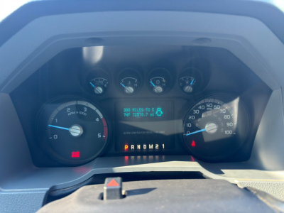 Dashboard of a 2016 Ford F550 showing instrument cluster with tachometer, speedometer, and digital display indicating miles and gear selection.