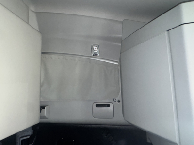 Kenworth T680 sleeper cab interior showing side wall storage and wall panel.