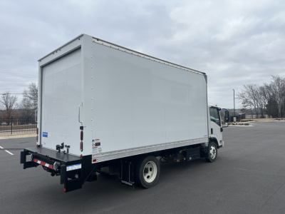 Box truck with white cargo box and cab, rear view showing cargo area and bumper.