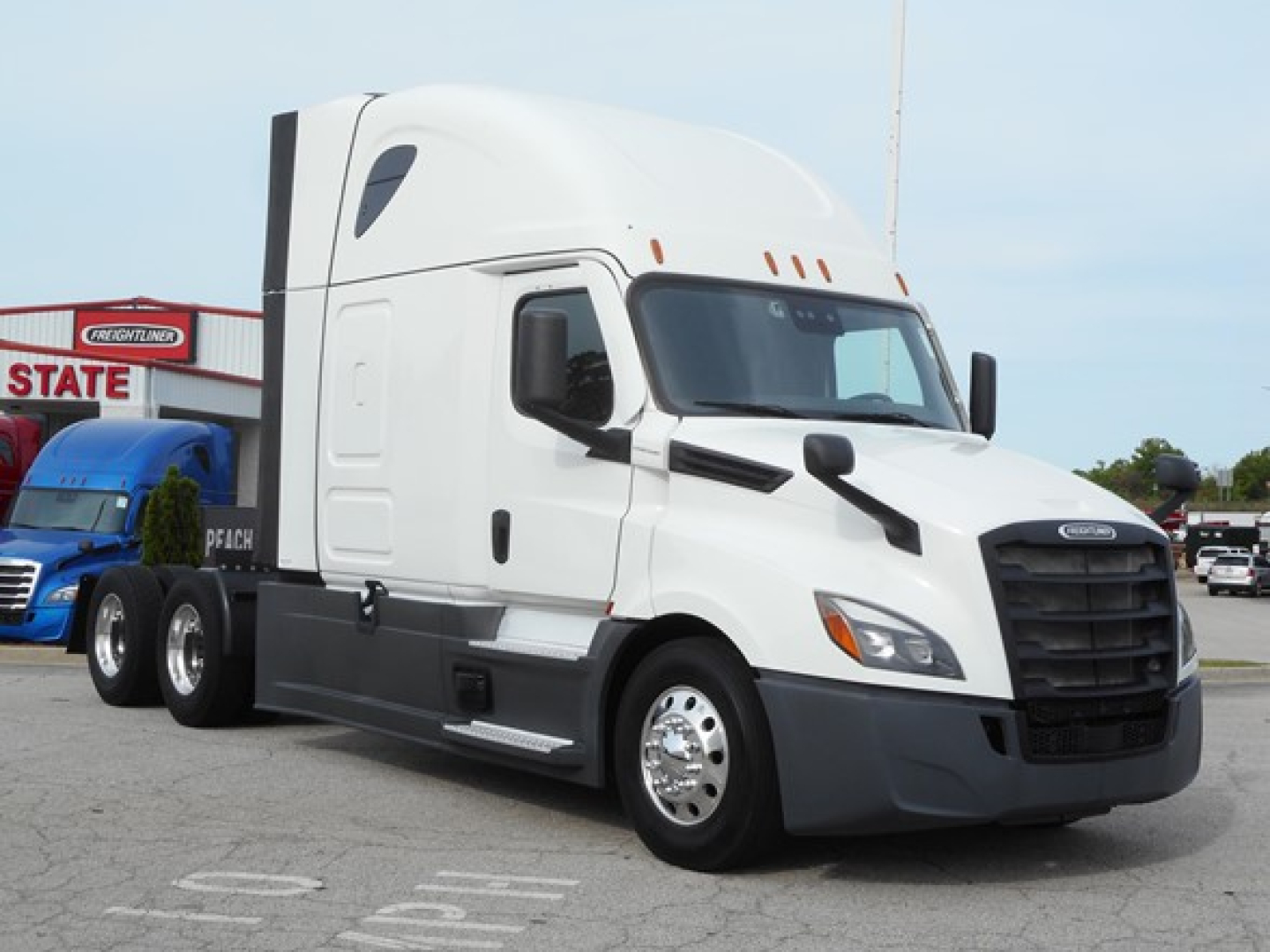 Truck: 2023 Freightliner Cascadia 126 conventional sleeper, white with black grille, side mirrors, chrome fuel tanks, dual rear axles, VIN 3AKJHHDR0PSUE0564