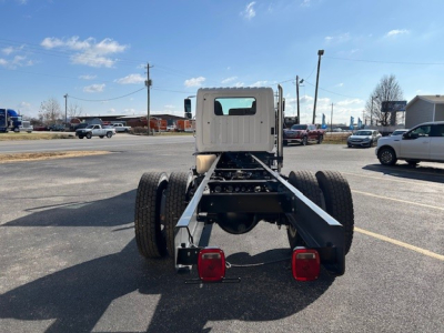 Rear view of a new 2025 Hino L7 cab and chassis chassis frame with dual rear wheels and taillights visible.